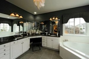 A beautiful dark countertop in a white kitchen