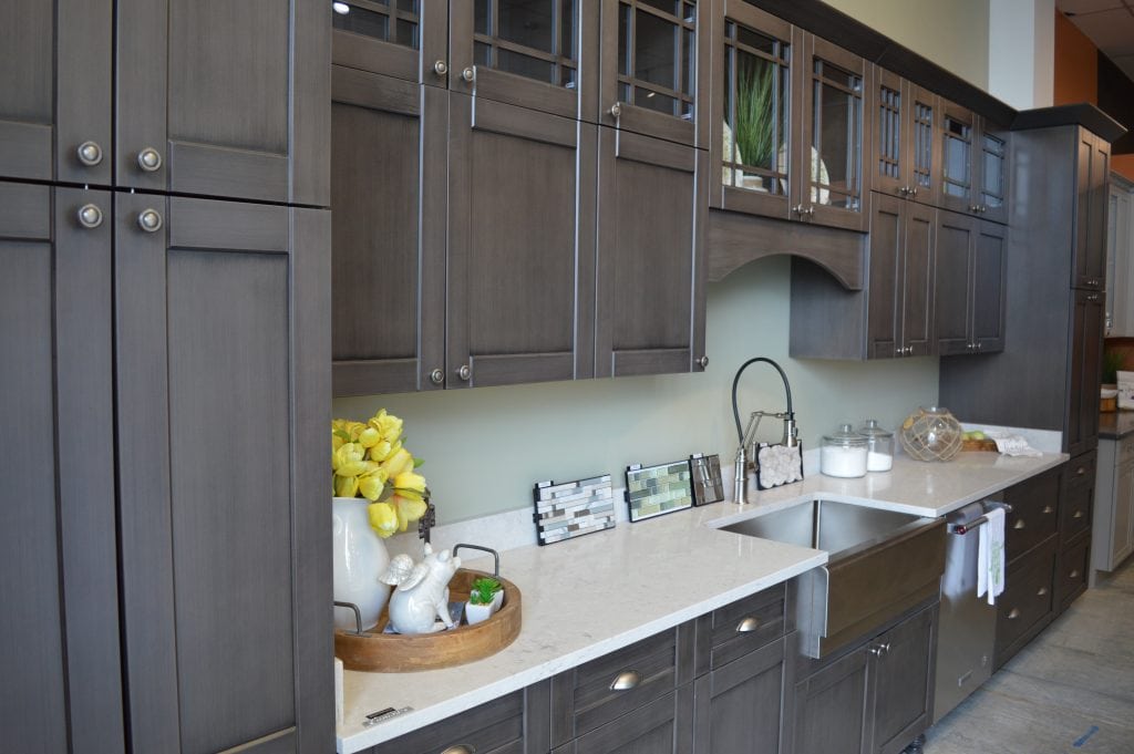 ivory counter and brown kitchen cabinets
