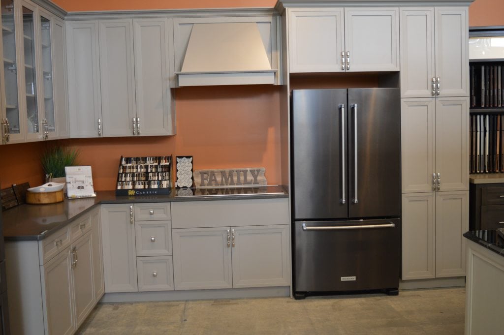 beige cabinets and orange walls