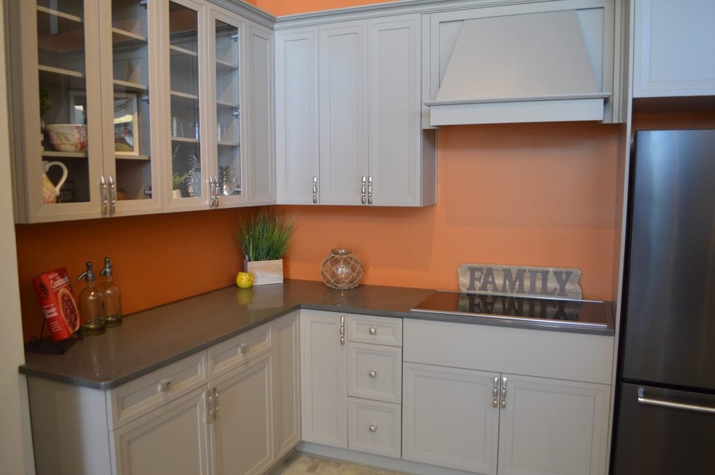 beige cabinets and orange walls