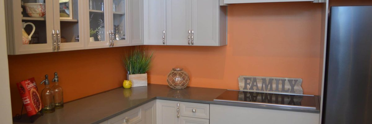 beige cabinets and orange walls